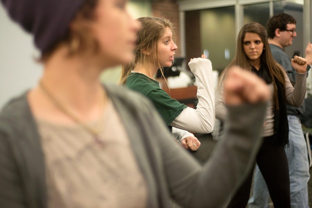 <p>Dietetics senior Darlene Hogan shows off self-defense moves Feb. 25, 1014, at Case Hall. The self-defense class started with a discussion about sexual assault and red flags to look out for. Julia Nagy/The State News</p>