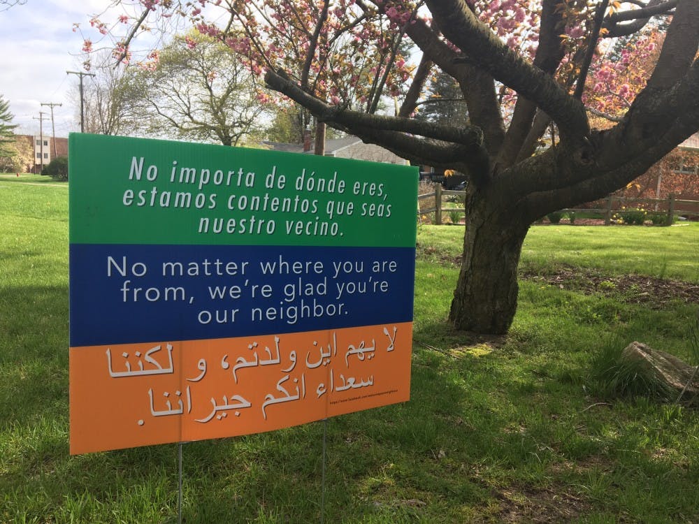<p>A "welcome your neighbor" sign in East Lansing.</p>