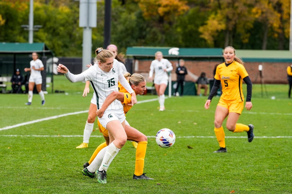 <p>University of Iowa player grabs Michigan State University graduate student defender Celia Gaynor (15) at DeMartin Soccer Complex on Oct. 29, 2023. </p>