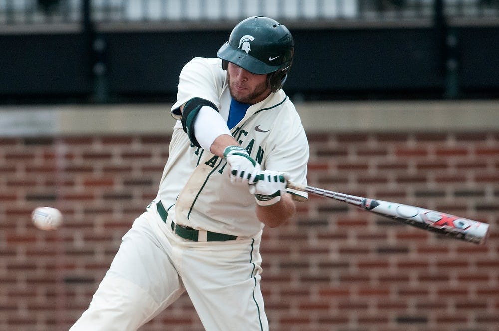 <p>Junior outfielder/catcher Jimmy Pickens takes a swing at a ball during the game against Purdue on April 12, 2014, at McLane Baseball Stadium at Old College Field. The Spartans defeated the Boilermakers, 2-1. Danyelle Morrow/The State News</p>