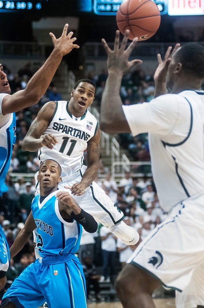 	<p>Junior guard Keith Appling delivers a pass underneath the basket on Oct. 30 at Breslin Center. Adam Toolin/The State News</p>