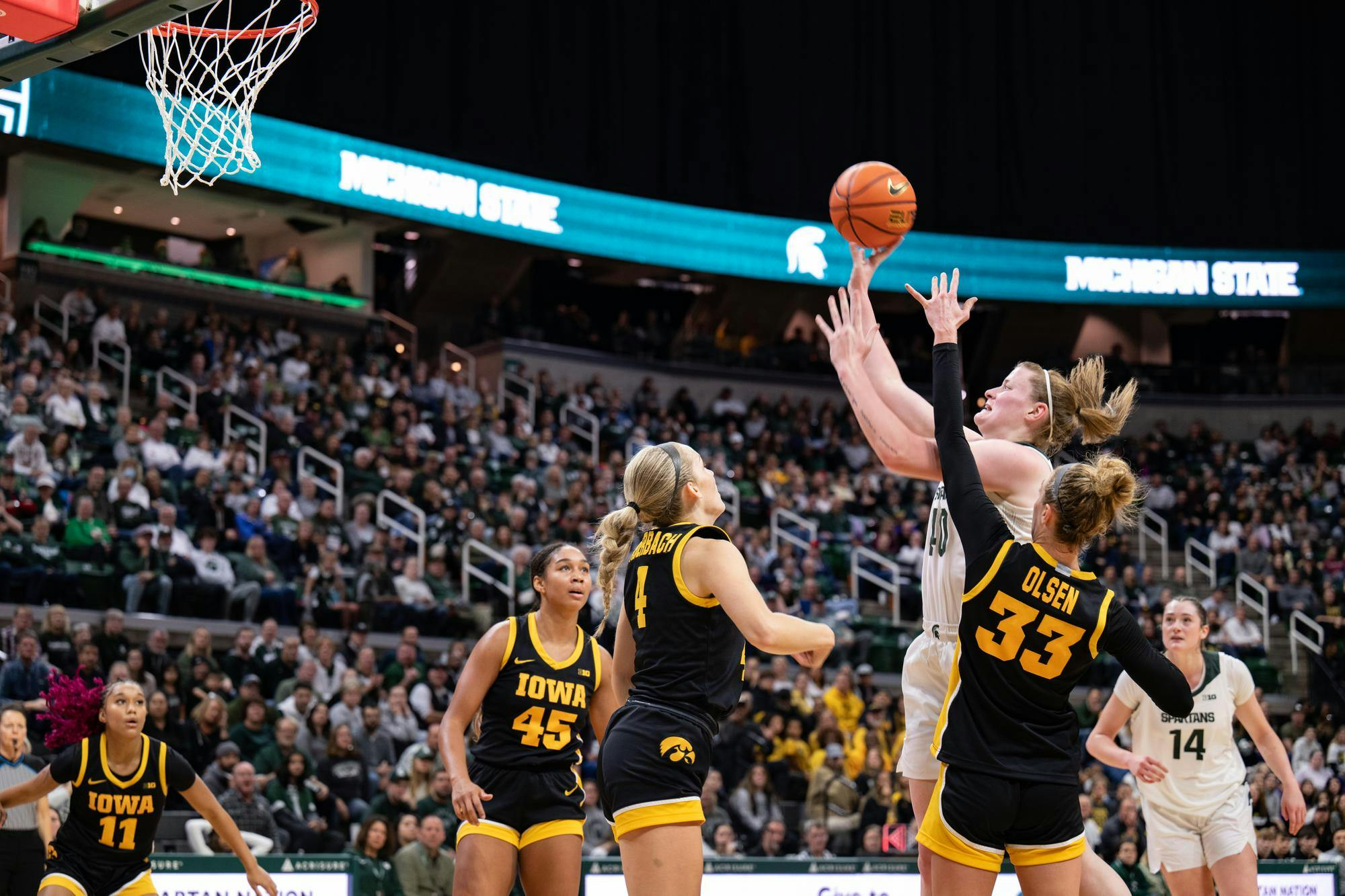 <p>MSU graduate guard Julia Ayrault (40) scores against the Iowa Hawkeyes at Breslin Center on Dec. 15, 2024.</p>