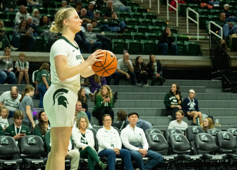 <p>Freshman guard Theryn Hallock (4) debates who she is going to pass the ball to at the game against Oakland at the Breslin Center on Nov. 15, 2022. The Spartans defeated the Grizzlies 85-39. </p>