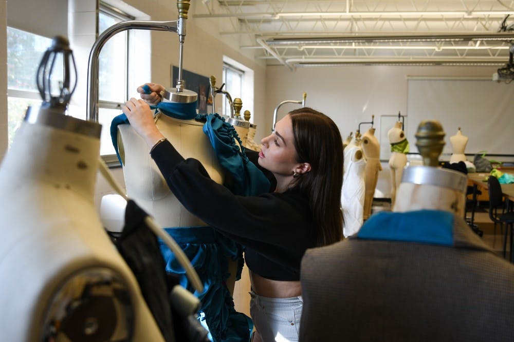 Apparel and textile design major and MSU senior Mikayla Frick works in her studio at the Urban Planning and Landscape Architecture building on October 15, 2019. 