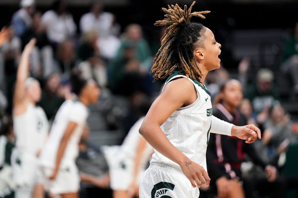 <p>Junior guard DeeDee Hagemann (0) celebrates after her teammate redshirt junior guard Lauren Ross (24) scores a three-pointer during the season-opening exhibition game against Davenport University at the Breslin Center on Nov. 2, 2023. The Spartans annihilated the Panthers with a score of 99-45.&nbsp;&nbsp;</p>