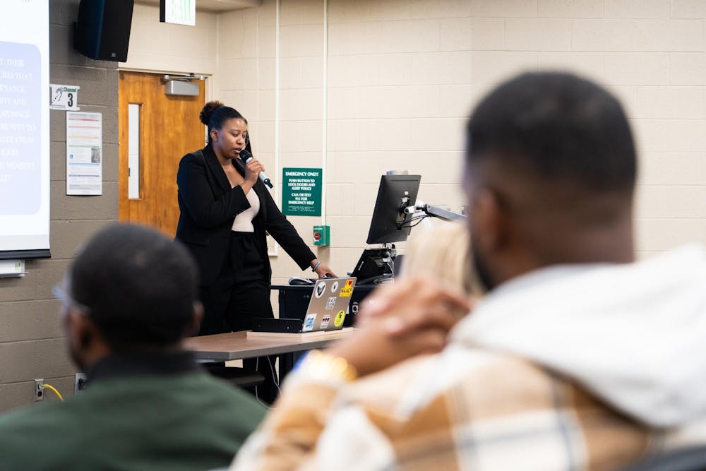 Social work senior Miselo Chola speaks to the crowd at a Michigan State University NAACP town hall meeting on MSU's campus on Tuesday, March 26, 2024. Students discussed institutional racism within the university and spoke in defense of MSU trustee Rema Vassar.