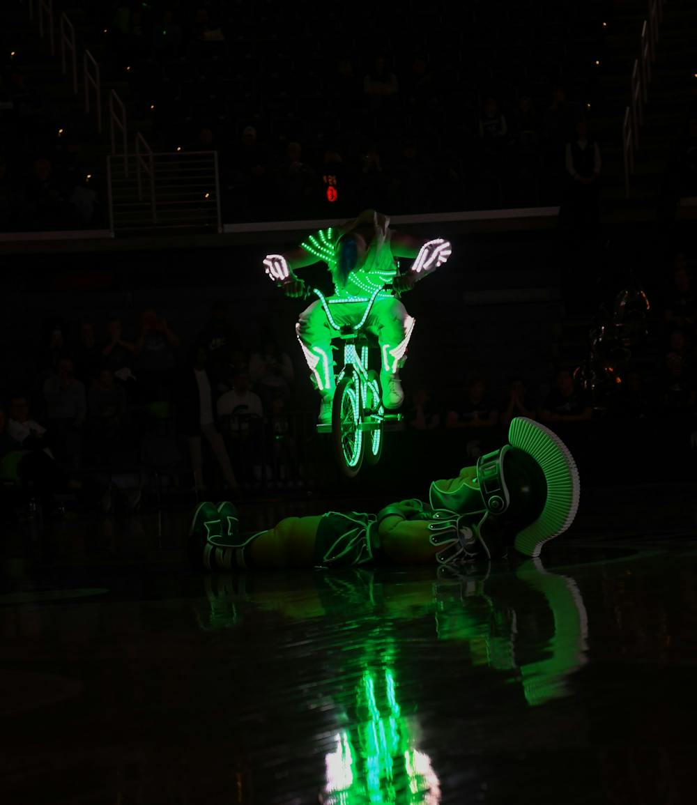 Half-time show performer jumps over Sparty on a bike during the women's basketball game against Ohio State on January 16, 2019. The Spartans defeated the Buckeyes 68-65. 