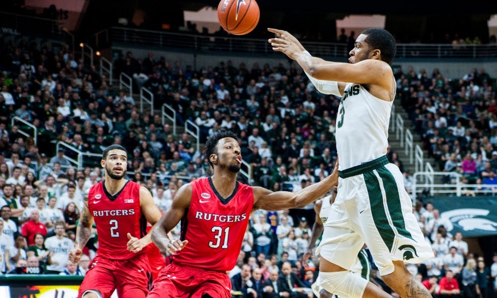 Junior guard Alvin Ellis III shoots the ball over Rutgers guard Omari Grier during the second half of the game against Rutgers on Jan. 31, 2016 at Breslin Center. The Spartans defeated the Scarlet Knights, 96-62.