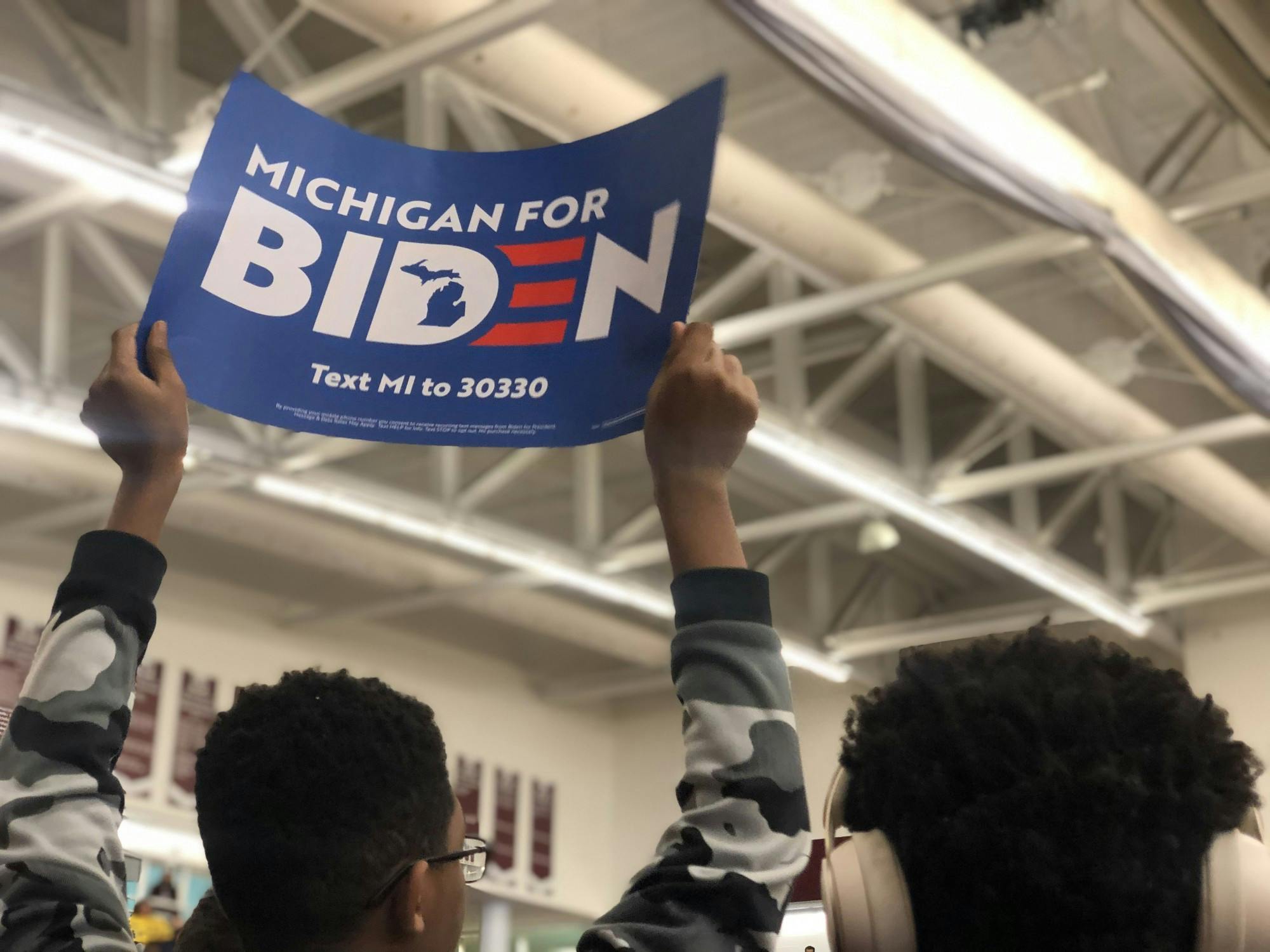 <p>A supporter of former vice president and presidential candidate Joe Biden&#x27;s campaign holds a sign at an event in Detroit.</p>