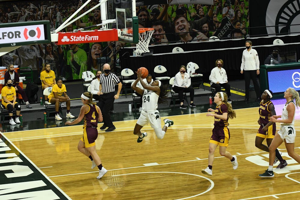 <p>Michigan State guard Nia Clouden glides to the rim in transition to score two of her team-leading 21 points in the Spartans win over Central Michigan on Friday, Dec. 18, 2020 at the Breslin Center.</p>