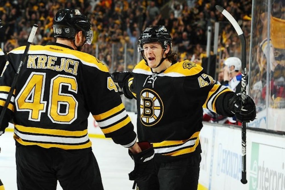 <p>Boston Bruins defenseman and former Spartan Torey Krug opens his arms to celebrate with Bruins center David Krejci during the Eastern Conference semifinals of 2013 NHL Playoffs against the New York Rangers. The Bruins won the series 4-1. Courtesy photo by Boston Bruins</p>