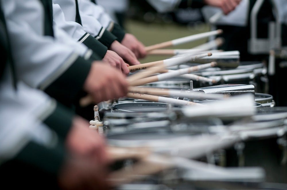 <p>The MSU Drumline performs for the stadium Nov. 22, 2014, during the game against Rutgers at Spartan Stadium. The Spartans defeated the Scarlet Knights, 45-3. Raymond Williams/The State News</p>