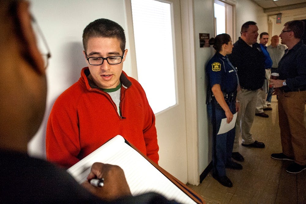 	<p>Michigan State Police Sgt. Keely Cochran, left, questions criminal justice junior Andrew Horvath during a mock homicide training session June 5, 2013, at 2500 S Washington Ave. in Lansing. The program has been ongoing for about 20 years, which helps law enforcement officials to handle real world situation. Justin Wan/The State News</p>