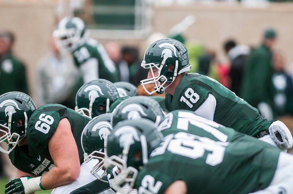 	<p>Sophomore quarterback Connor Cook lines up for warm-ups for the game against Purdue on Oct. 19, 2013, at Spartan Stadium. The Spartans defeated the Boilermakers, 14-0. Khoa Nguyen/The State News</p>