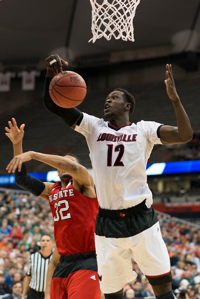 <p>Louisville forward/center Mangok Mathiang attempts a basket March 27, 2015, during the East Regional round of the NCAA Tournament in a game against North Carolina State at the Carrier Dome in Syracuse, New York. The Cards defeated the Wolfpack, 75-65. Erin Hampton/The State News</p>