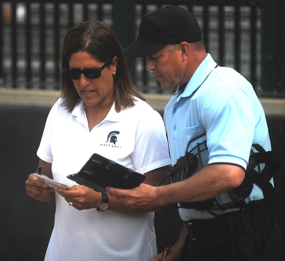 <p>MSU softball head coach Jacquie Joseph talks with the referee April 17, 2015, during a game against Minnesota at Secchia Softball Stadium. The Spartans were defeated by the Golden Gophers, 8-4. Alice Kole/The State News</p>