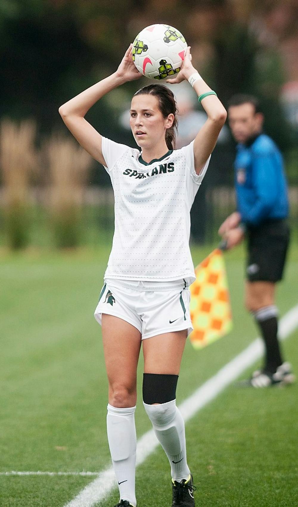 <p>Junior defender Aleksandra Gjonaj picks out a teammate for the throw Oct. 2, 2014, during the game against the University of Iowa at DeMartin Soccer Stadium at Old College Field. The Spartans lost to the Hawkeyes 0-1. Raymond Williams/The State News</p>