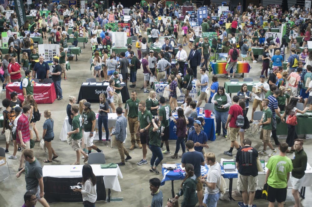 Students walk the floor of the Breslin Center during Sparticiaption on Sept. 18 2016. The event was held to help students and clubs connect.