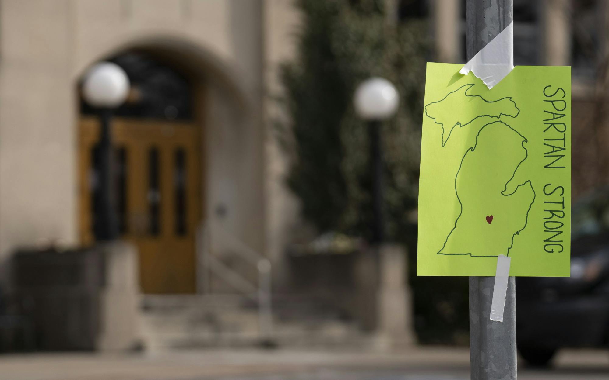 A “Spartan Strong” sign hangs outside of the Union on Monday, Feb. 20, 2023 - the first day of classes back for Michigan State after the shooting in the university’s north campus seven days earlier. 