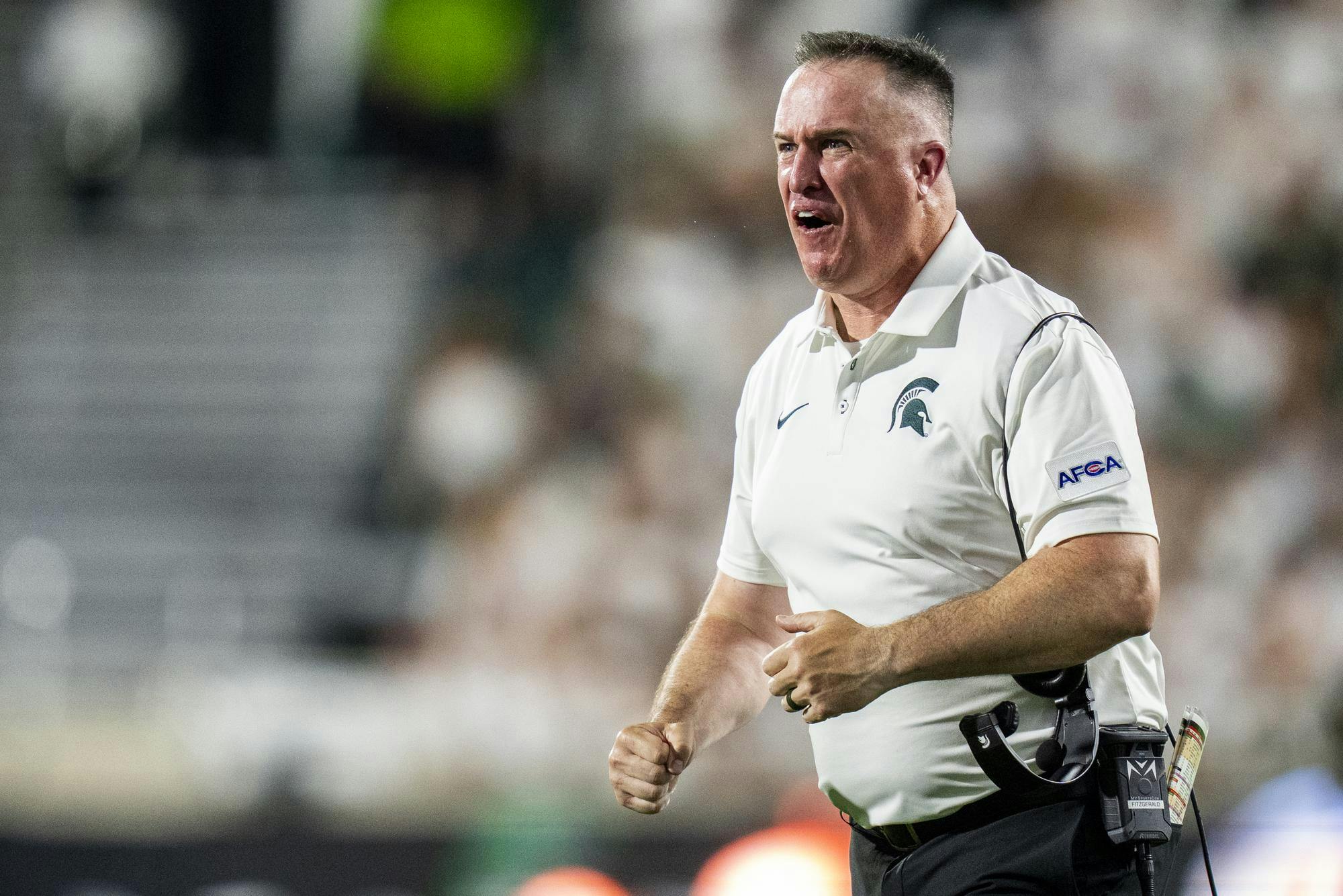 <p>Michigan State head coach Pat Fitzgerald celebrates from the sideline during the Michigan State vs. Toledo football game at Spartan Stadium in East Lansing, Mich., on Friday, Sept. 4, 2026.</p>