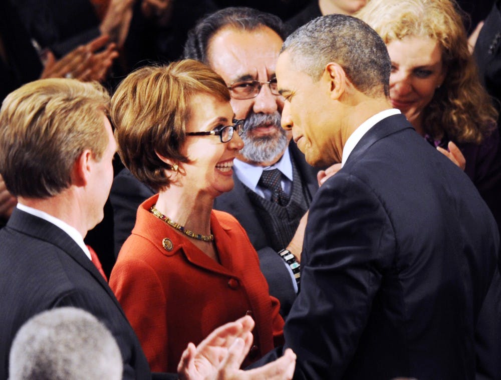 U.S. President Barack Obama greets Rep. Gabrielle Giffords (D-AZ) before giving the State of the Union address before a joint session of Congress, Tuesday, January 24, 2012, in Washington, D.C. (Olivier Douliery/Abaca Press/MCT)