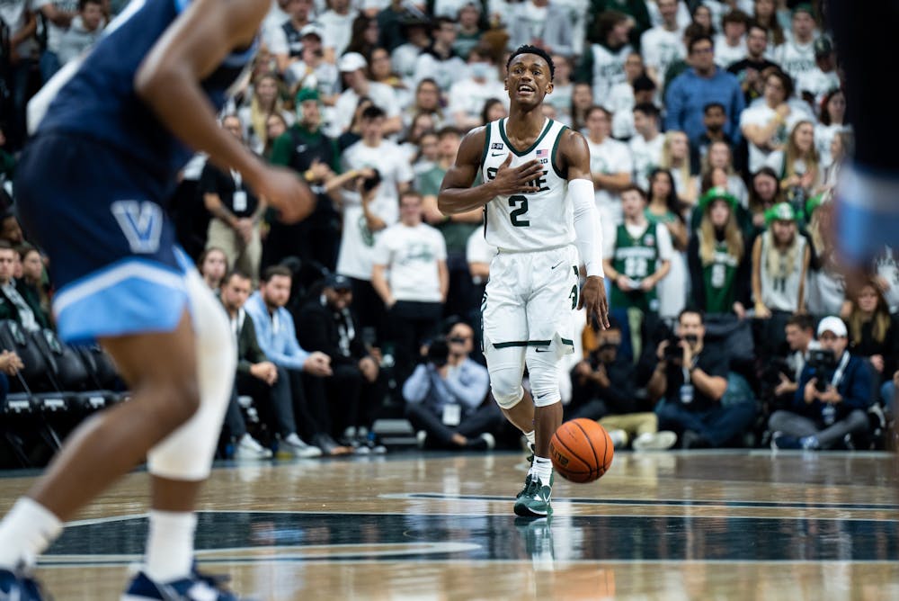 Senior guard Tyson Walker (2) dribbles the ball during a game against Villanova at the Breslin Center on Nov. 18, 2022. The Spartans defeated the Wildcats 73-71. 