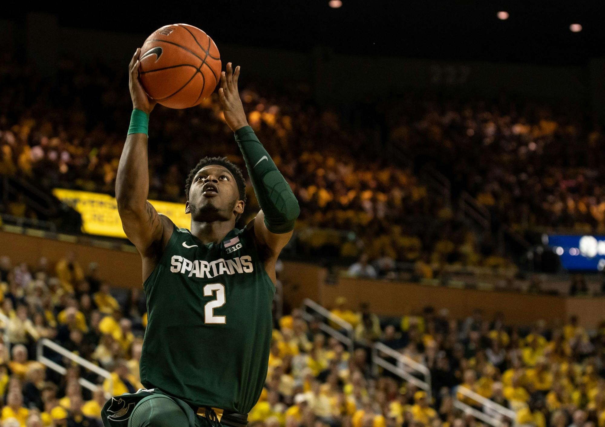 Freshman guard Rocket Watts (2) shoots a layup during the game against Michigan Feb. 8, 2020 at Crisler Center.