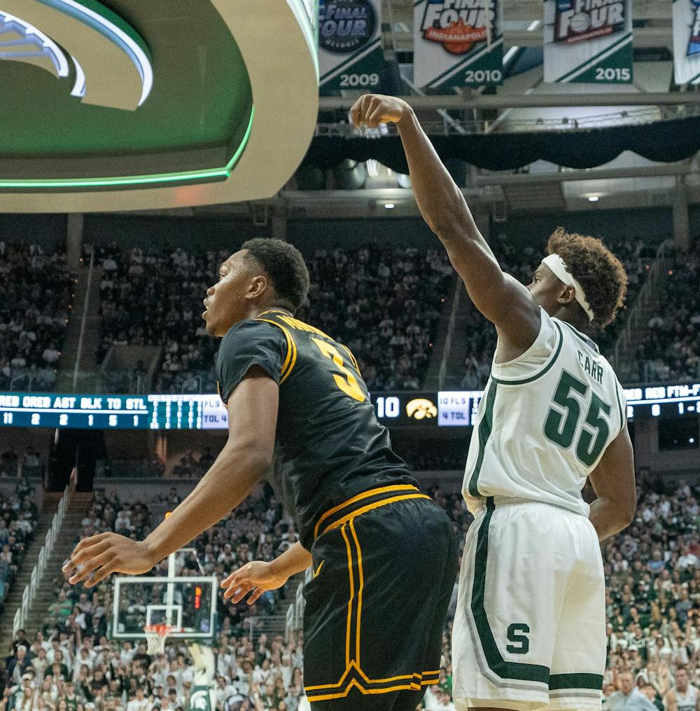 <p>Junior forward Coen Carr (55) rises for a basket during the matchup against the University of Iowa at the Breslin Center on Dec. 2, 2025.</p>