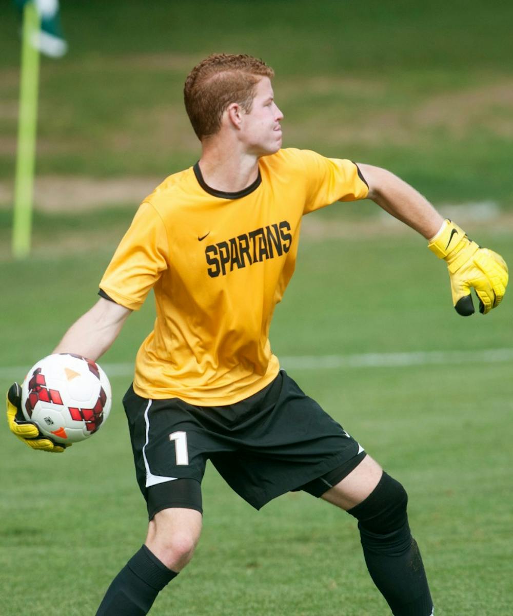 	<p>Sophomore goaltender Zach Bennett throws the ball to a teammate Sunday, Sept. 1, 2013, at DeMartin Stadium. Bennett had a shutout game as the Spartans defeated the Western Michigan Broncos 4-0. Katie Stiefel/The State News</p>