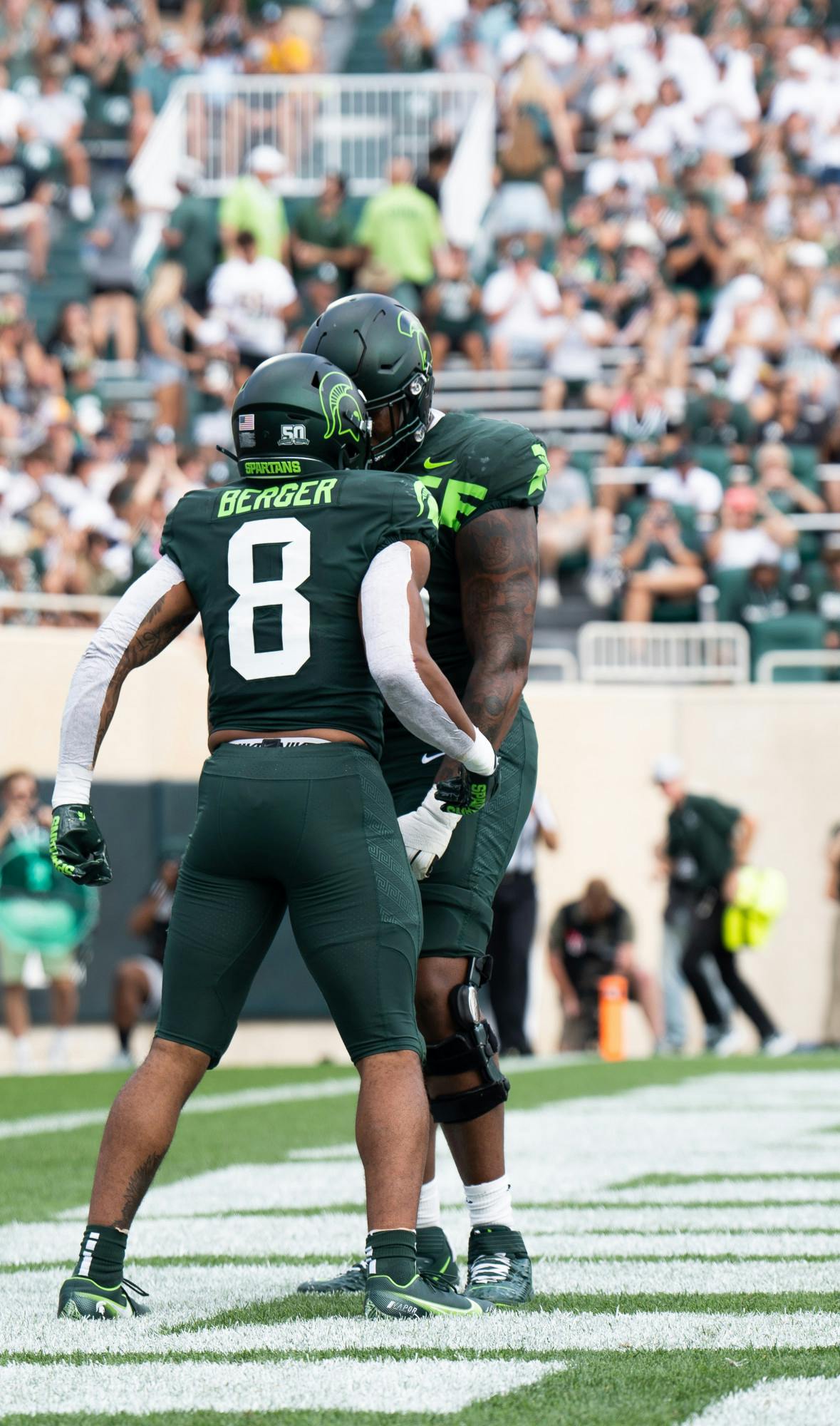 Redshirt sophomore running back Jalen Berger (8) celebrates after making a touchdown against Akron at the Spartan Stadium on Sept. 10, 2022. The Spartans beat the Zips with a score 52 to 0. 