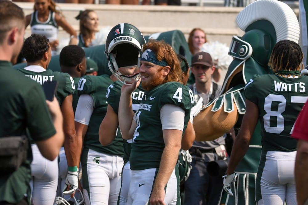 <p>Spartans kicker Matt Coghlin celebrates the win against Youngstown State on Sept. 11, 2021.</p>