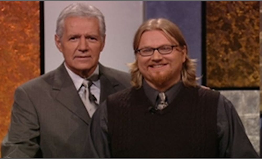 <p>Host of the gameshow Jeopardy Alex Trebek and MSU Professor Dan Smith</p>