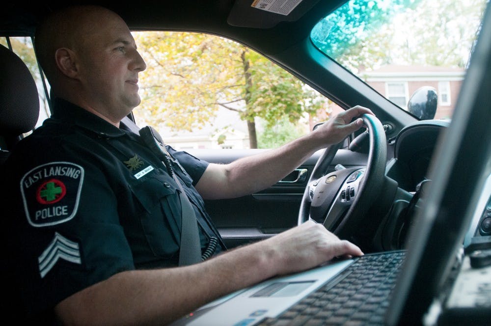 <p>Sgt. Andrew Bouck of the East Lansing Police Department patrols during his shift on Oct. 24, 2015.</p>
