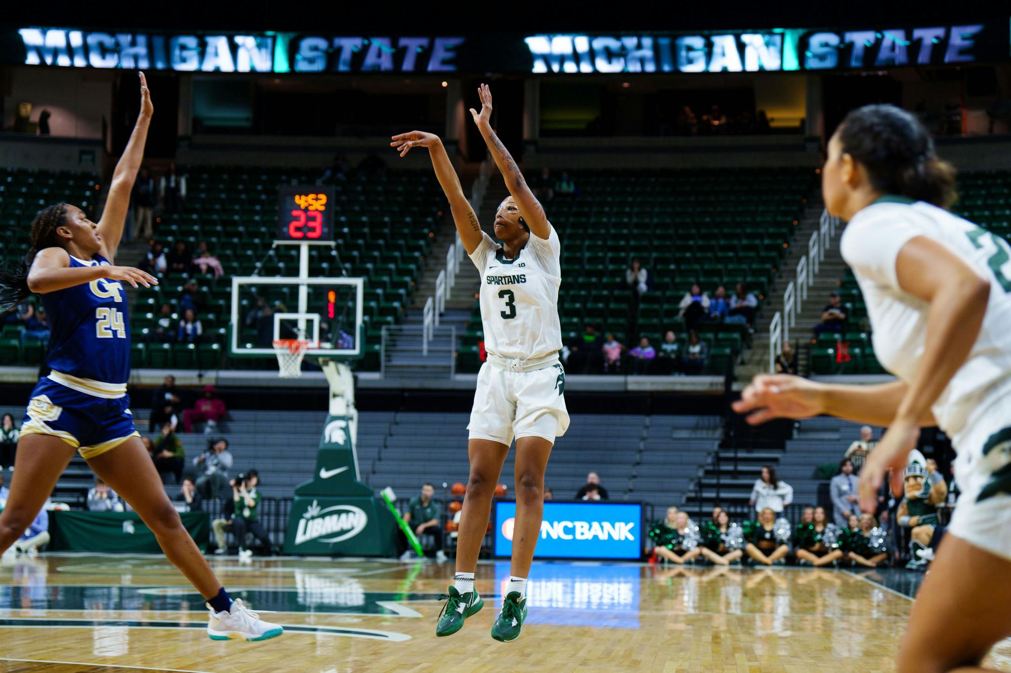 <p>Junior guard Gabby Elliot (3) shoots a three-pointer during a game against Georgia Tech, held at the Breslin Center on Dec. 1, 2022. The Spartans fell to the Yellow Jackets 63-66.</p>