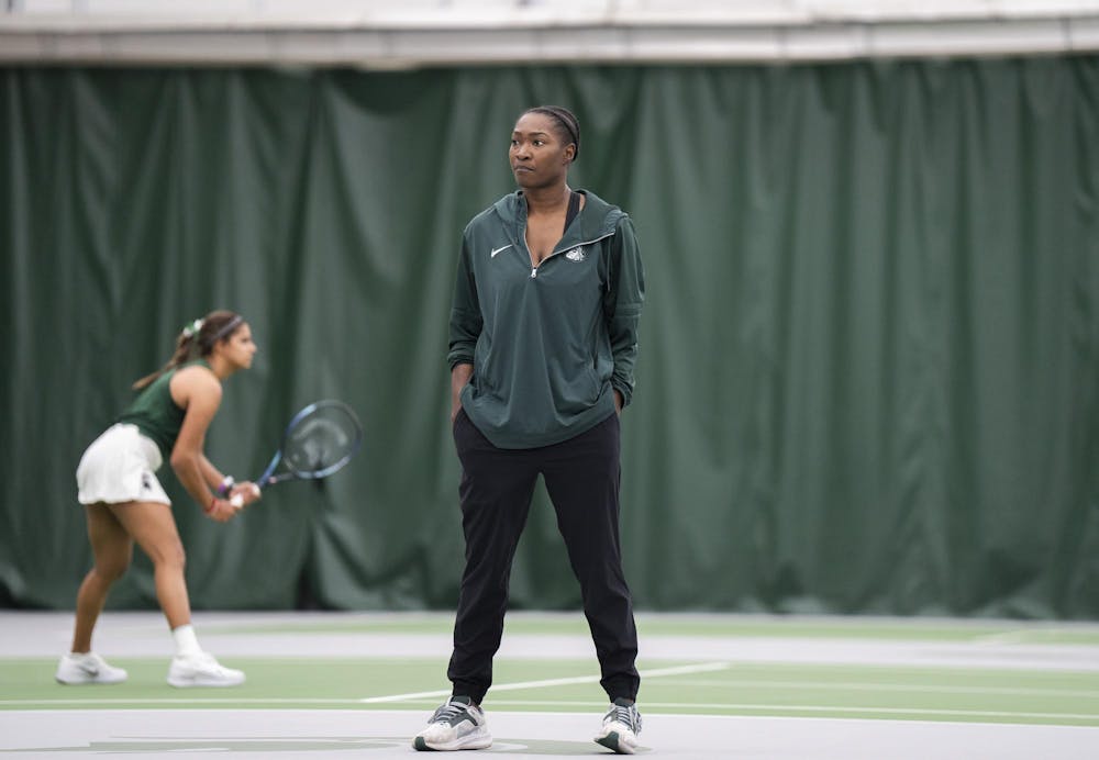 MSU women tennis assistant coach Mary Lewis keeps track of multiple games during singles at the MSU Tennis Facility on Mar. 30, 24.