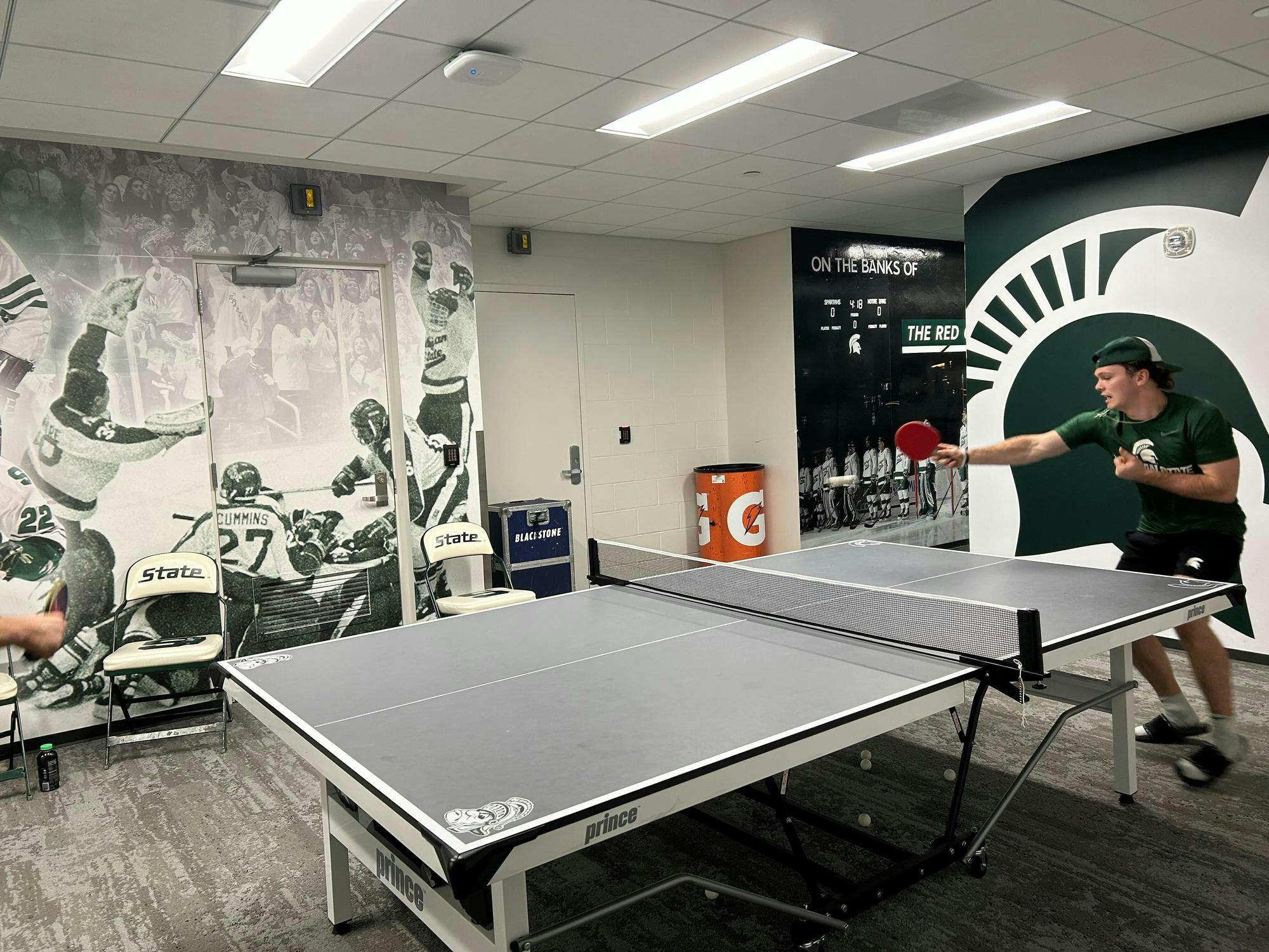 <p>MSU hockey junior Tiernan Shoudy keeps a pingpong rally alive on Nov. 1, 2024. Junior Karsen Dorwart said some members of the team play for about an hour every day.</p>