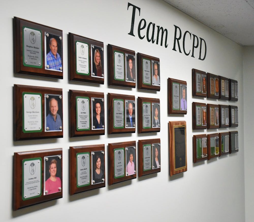 Plaques of RCPD leaders hang in the reception hallway in Bessey Hall, Room 120. RCPD director Michael Hudson is featured in the middle. 