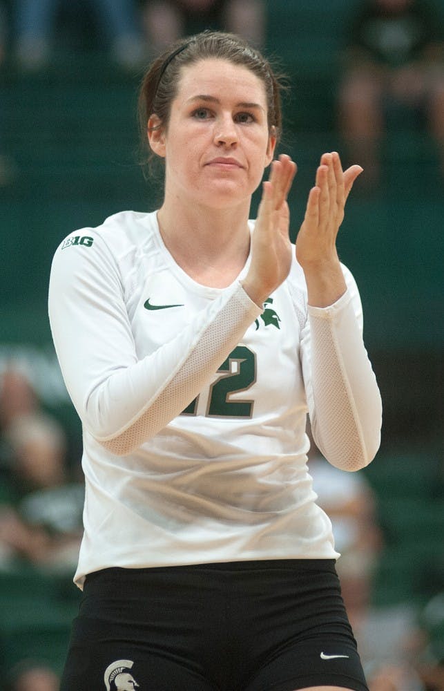 	<p>Junior setter Kristen Kelsay celebrates a point on Friday, Sept. 7, 2012 at Jenison Field House as the Spartans secure a point in late set five. <span class="caps">MSU</span> defeated <span class="caps">IPFW</span>, 3-2. Justin Wan/The State News</p>