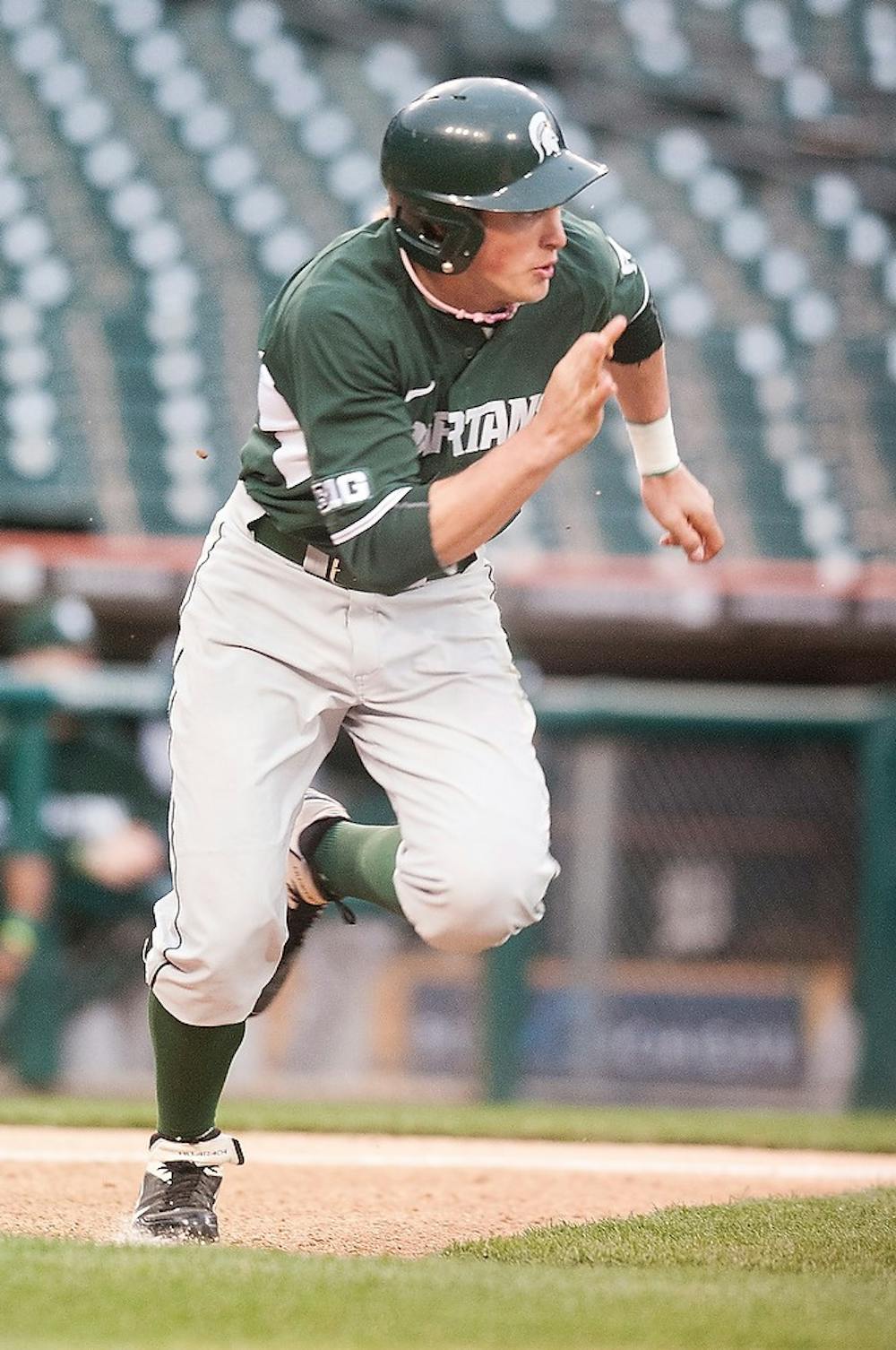 	<p>Freshman outfielder Cam Gibson runs from home plate after a hit Wednesday, April 17, 2013, at Comerica Park. <span class="caps">MSU</span> is beating Central Michigan in the middle of the fifth inning 1-0, with the remainder of the game set to be played May 14 in Mt. Pleasant. Danyelle Morrow/The State News</p>