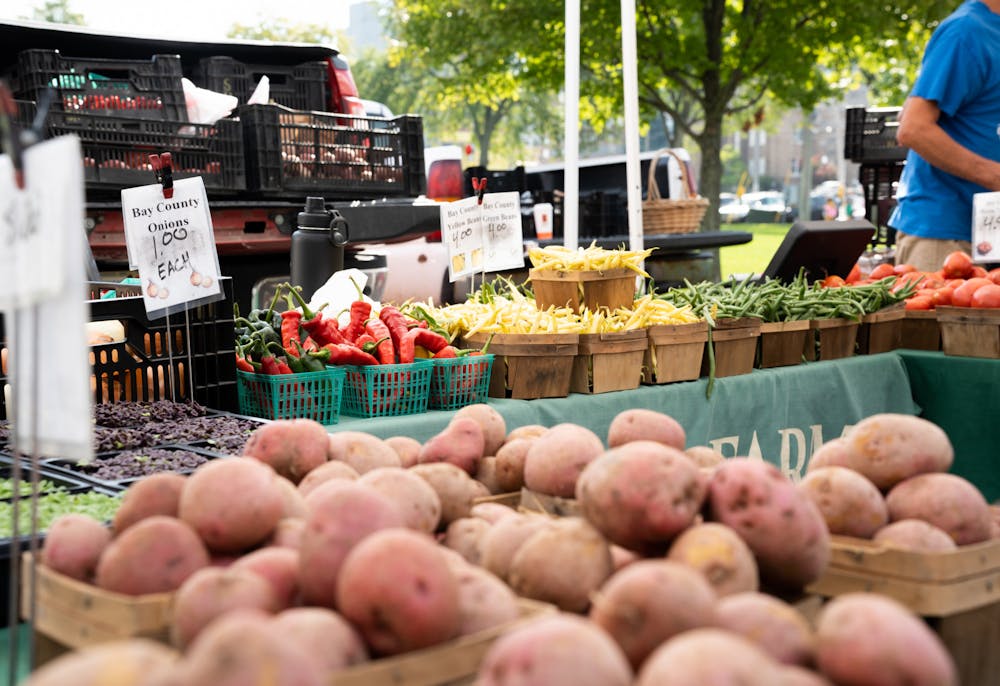 <p>A wide range of vegetables is set up for the Corrion Farm &amp; Greenhouse stand at the East Lansing Farmers Market on Sept. 18, 2022. </p>