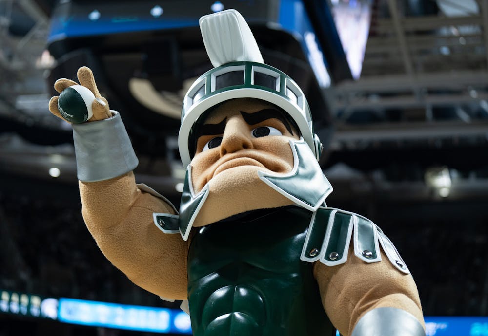 Sparty throws balls at the fans during a men's basketball game against Villanova at the Breslin Center on Nov. 18, 2022. The Spartans defeated the Wildcats 73-71. 