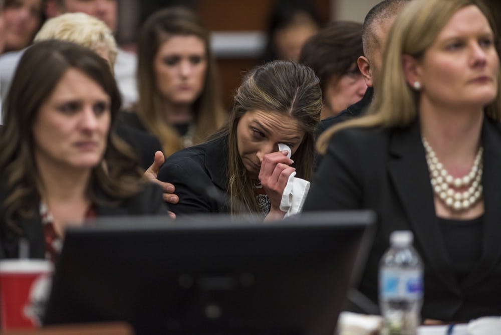 Kyle Stephens tears up during Rachael Denhollander's statement on the seventh and final day of Ex-MSU and USA Gymnastics Dr. Larry Nassar's sentencing on Jan. 24, 2018 at the Ingham County Circuit Court in Lansing. (Nic Antaya | The State News)