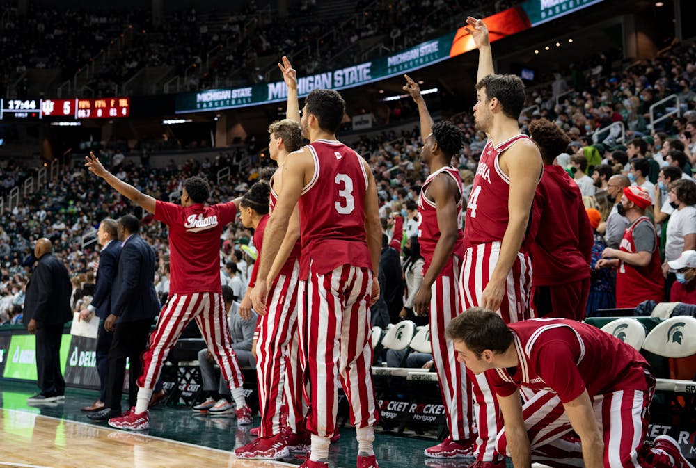 <p>Indiana&#x27;s sideline cheers after the Hoosiers score a three-pointer during Michigan State&#x27;s victory over Indiana on Feb. 12, 2022.</p>