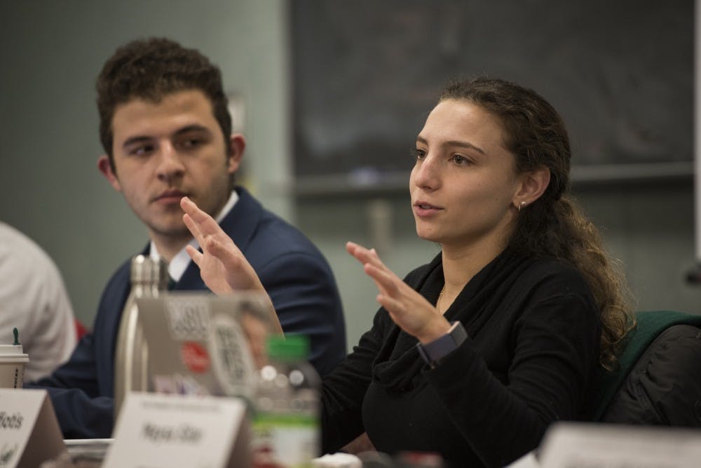 <p>ASMSU President Katherine "Cookie" Rifiotis speaks while Vice President for Internal Administration Mario Kakos listens during the ASMSU General Assembly meeting in the International Center on Feb. 14, 2019. Nic Antaya/The State News</p>
