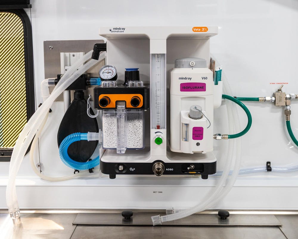 The anesthetic machine on the wall helps ensure the animals that are having procedures done on the MSU Veterinary Mobile Unit stay unconscious during the operation in Warren, Mich., on July 16, 2026.