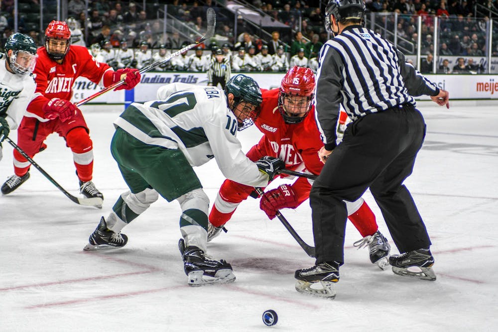 <p>Then-senior right wing Sam Saliba (10) fights for the puck during the game against Cornell at Munn Ice Arena on Nov. 1, 2019. The Spartans fell 2-3 to the Big Red.</p>