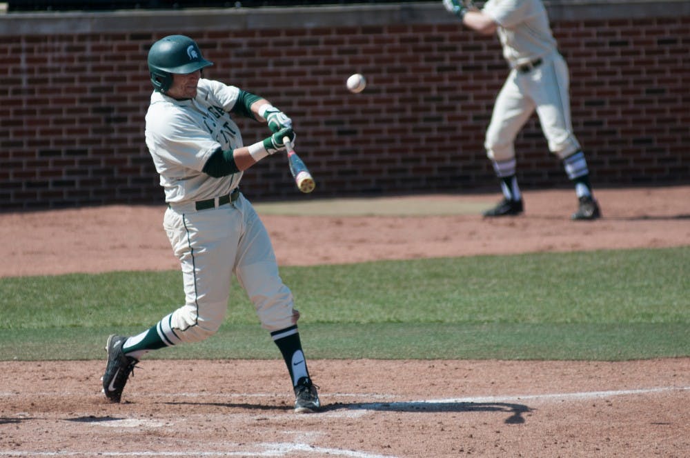 Junior outfielder Taylor Grace swings the bat during the game against Rutgers on March 27, 2016 at McLane Stadium. The Spartans defeated the Scarlet Knights, 6-5.