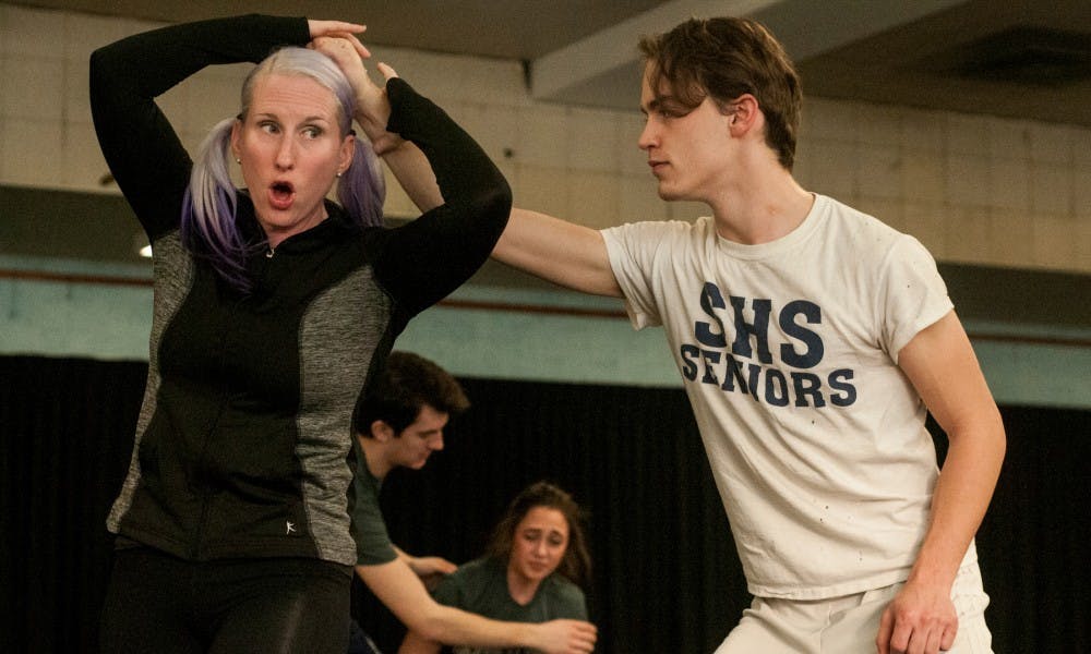 Theatre assistant professor Christina Traister demonstrates some moves with BFA theatre sophomore Mike Merluzzi, as she teaches a stage fight class on Dec. 8, 2015 at IM Sports-Circle. Assistant professor Traister is one of four certified female stage fight directors with the Society of American Fight Directors. 