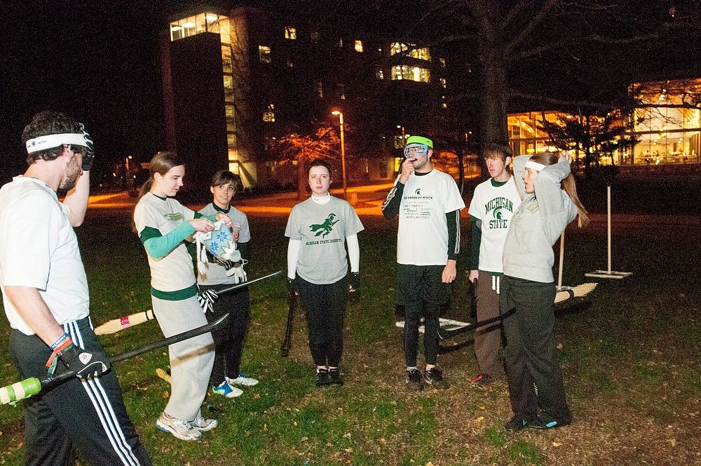 <p>The <span class="caps">MSU</span> quidditch team talks before a scrimmage on Thursday, Nov. 15, 2012, at Wonder’s Hall. The team played a scrimmage for the Harry Potter world event put on by the Wonders Hall RA’s. James Ristau/The State News</p>