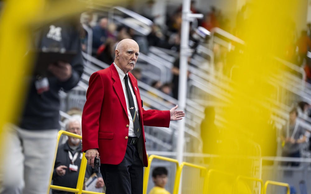 <p>A starter prepares for the next race at the Silverston Invitational track and field competition held in Ann Arbor, Mich. on Feb. 20, 2026.&nbsp;</p>